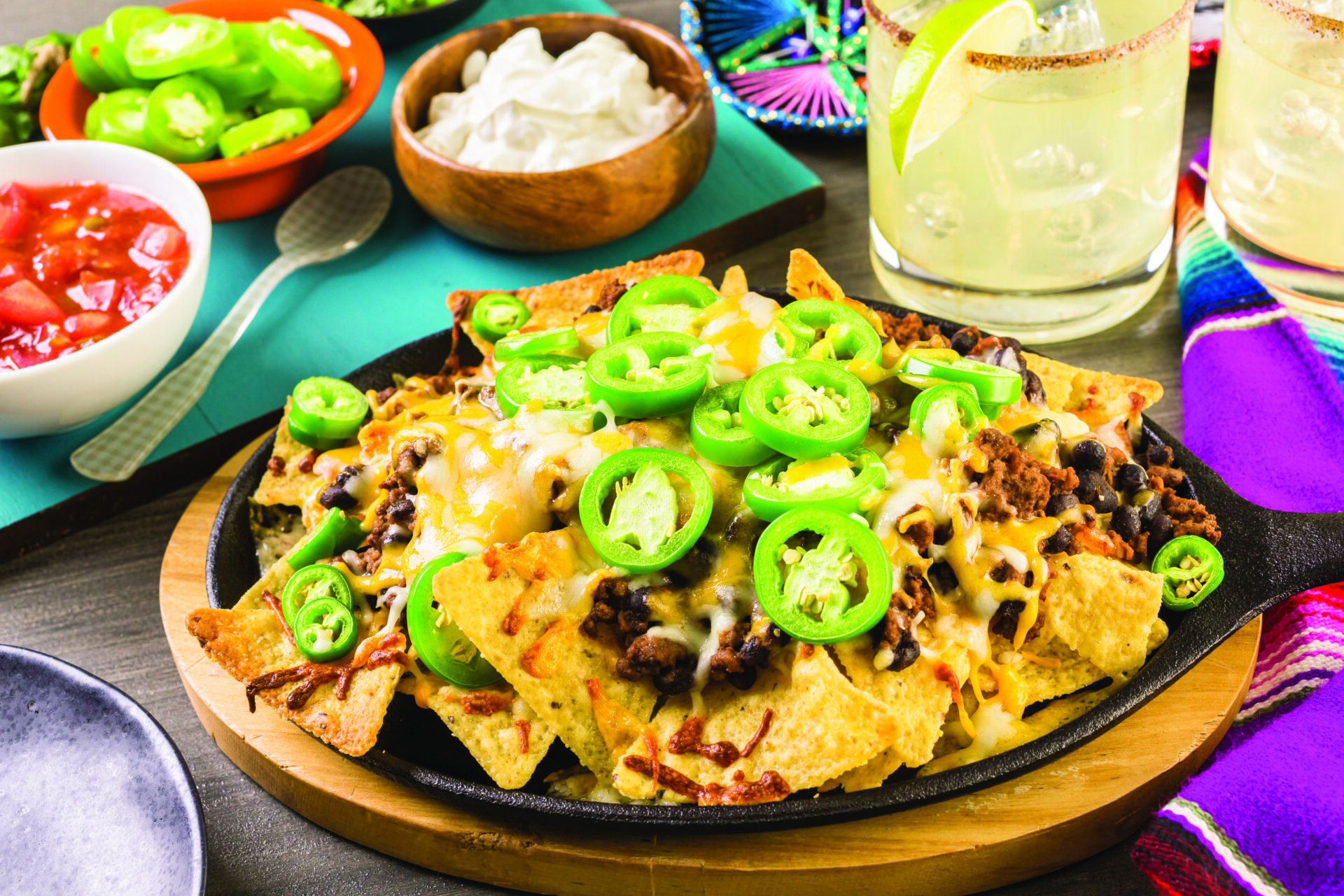 Classic nachos with ground beef and fresh jalapeno chili peppers.
