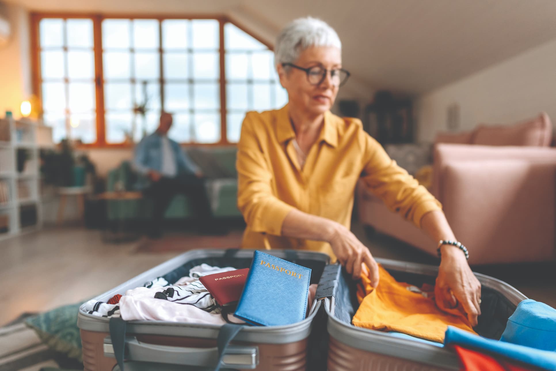 RichmondPlace_TravelSeminar-senior-packing Senior woman packing for international travel